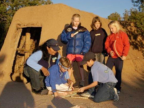 Students learning outside the Pithouse Learning Center